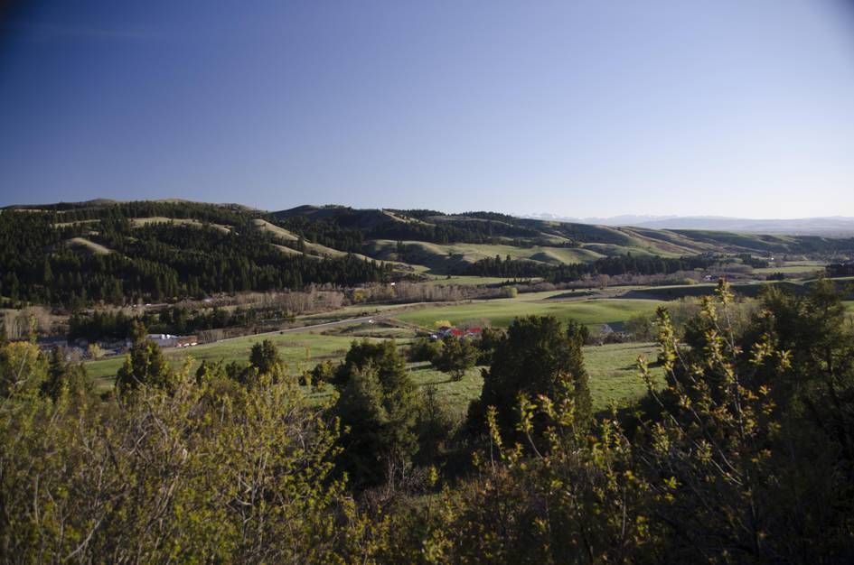 View of green valley with rolling hills and farmland