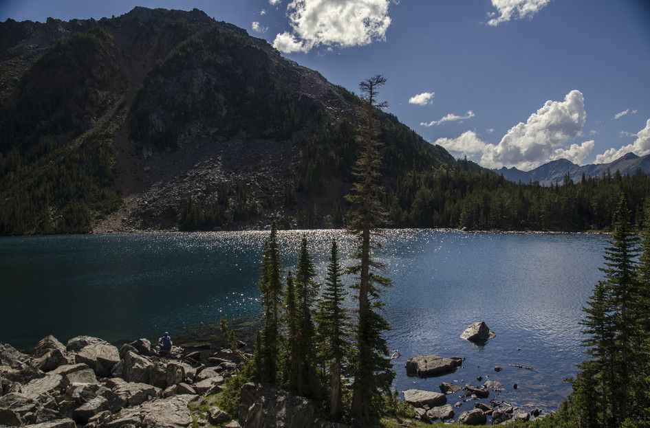 Sparkling Louise Lake with sunlight on water and rocky mountain backdrop