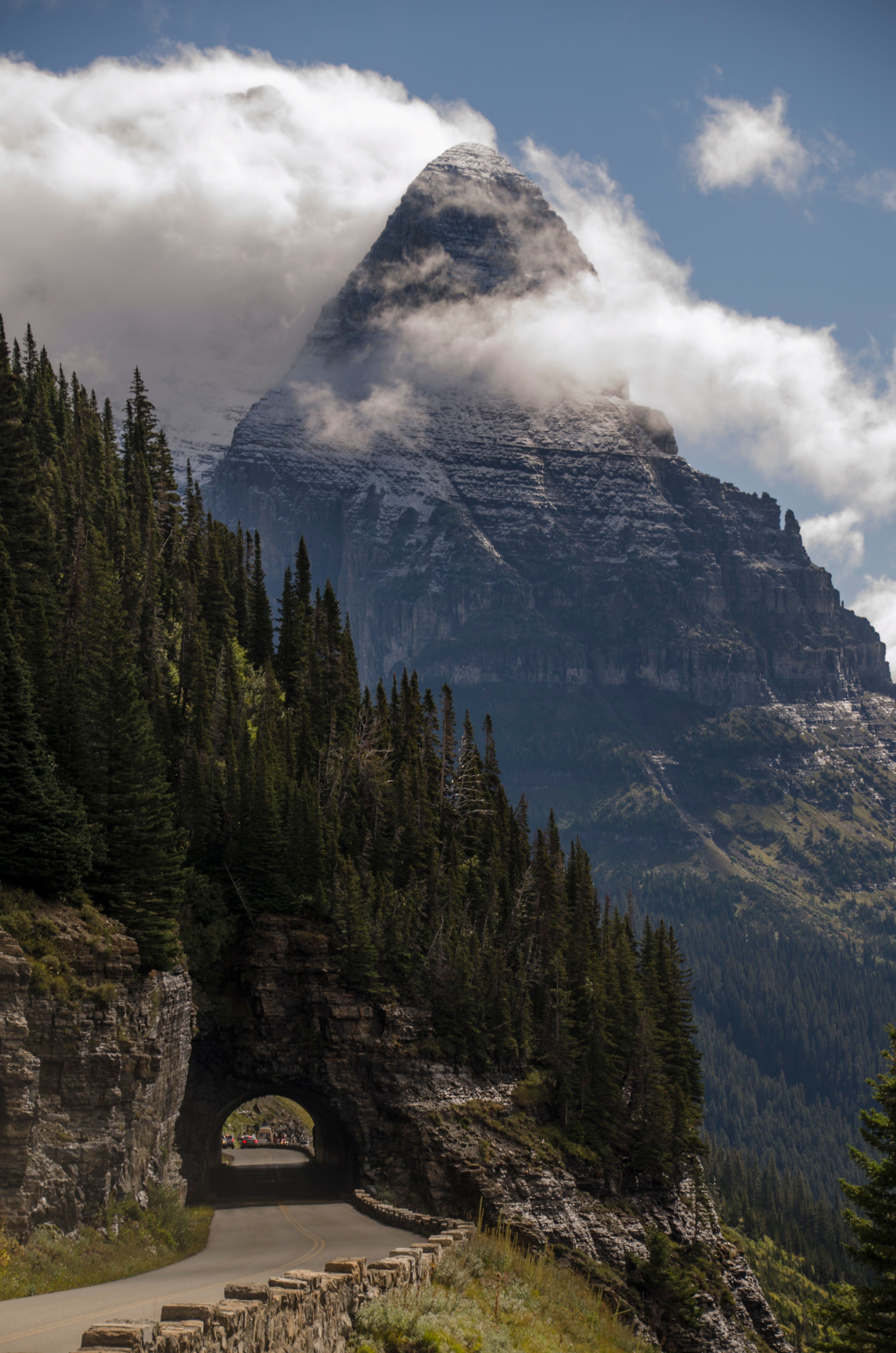 Road tunnel with mountain peak