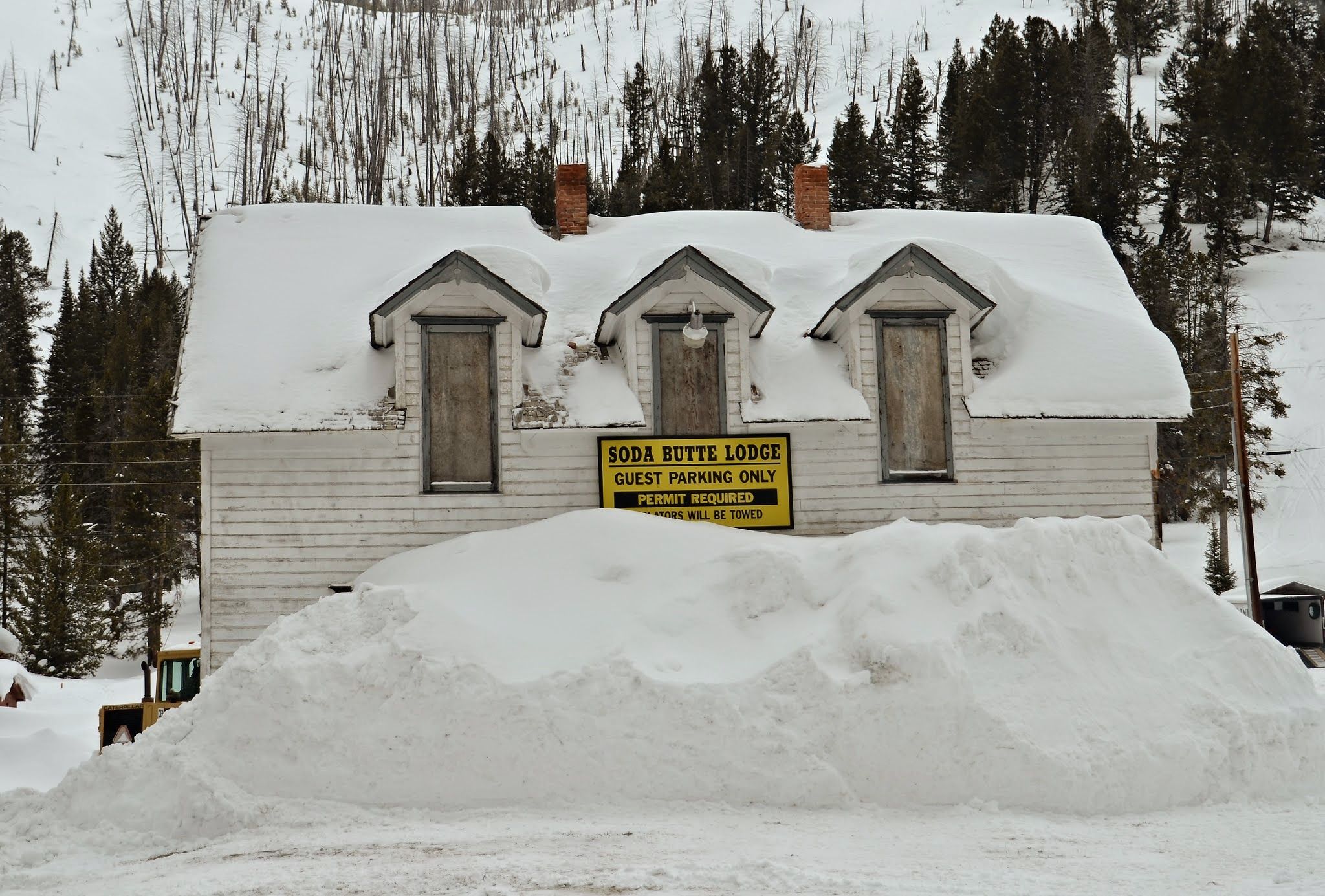 Soda Butte Lodge in Cooke City nearly buried by massive snow drifts with only the upper story windows visible