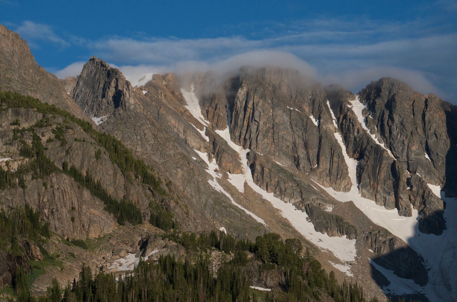 Rugged Beartooth peaks with vertical cliffs and lingering snow patches