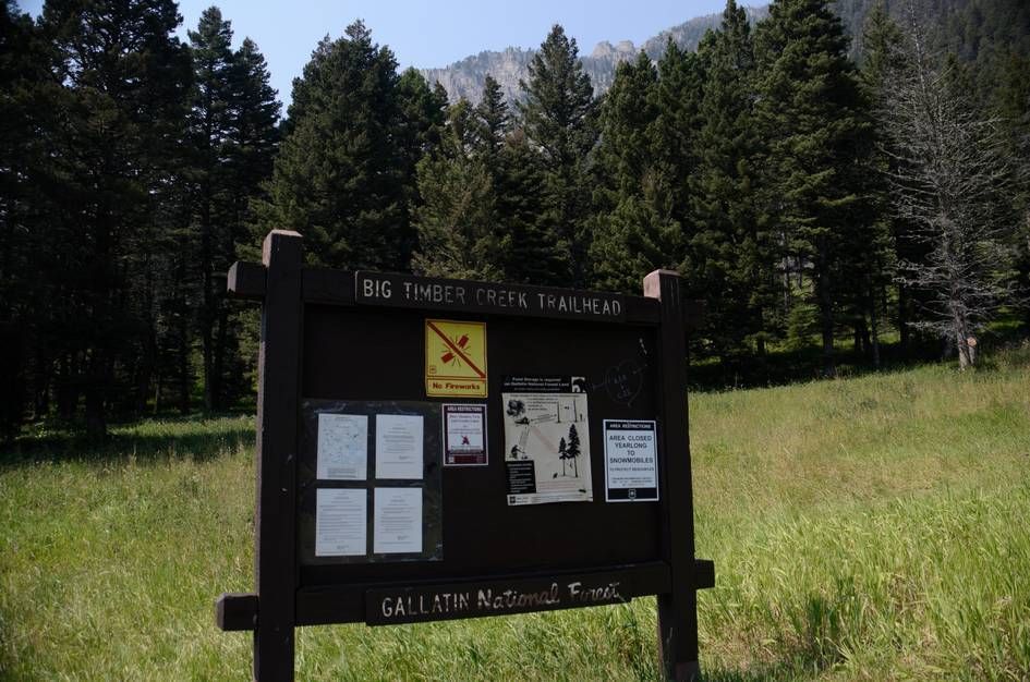 Big Timber Creek Trailhead information kiosk in Gallatin National Forest with rocky peaks