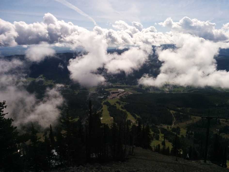 Dramatic view above the clouds looking down at Bridger Canyon valley