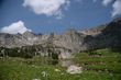 Beehive Basin alpine tarn reflecting jagged Madison Range peaks near Big Sky, Montana