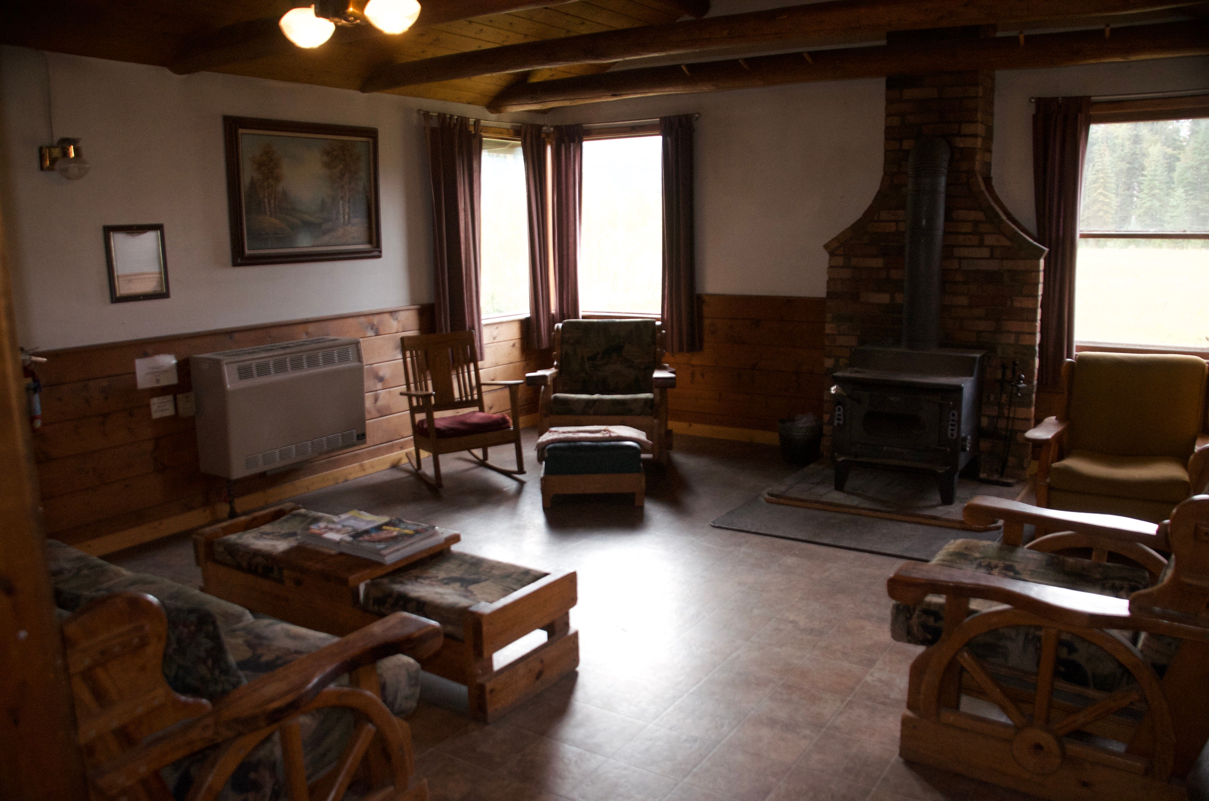 Ben Rover Cabin living room with wood stove and rustic furniture