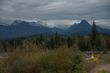 Snow-capped peaks of Glacier's Livingston Range viewed from the gravel North Fork Road