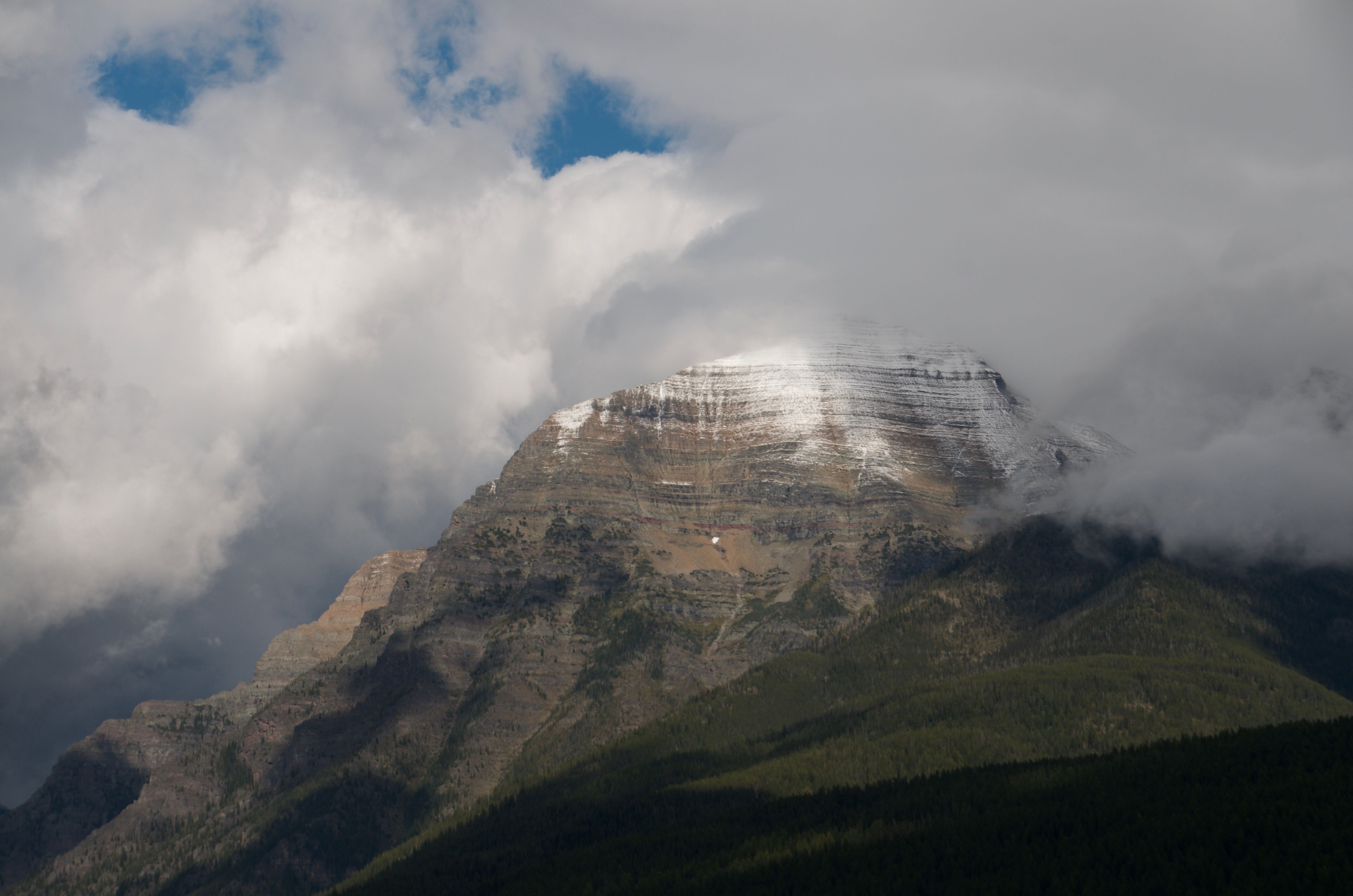Snow-dusted peak above Bowman Lake