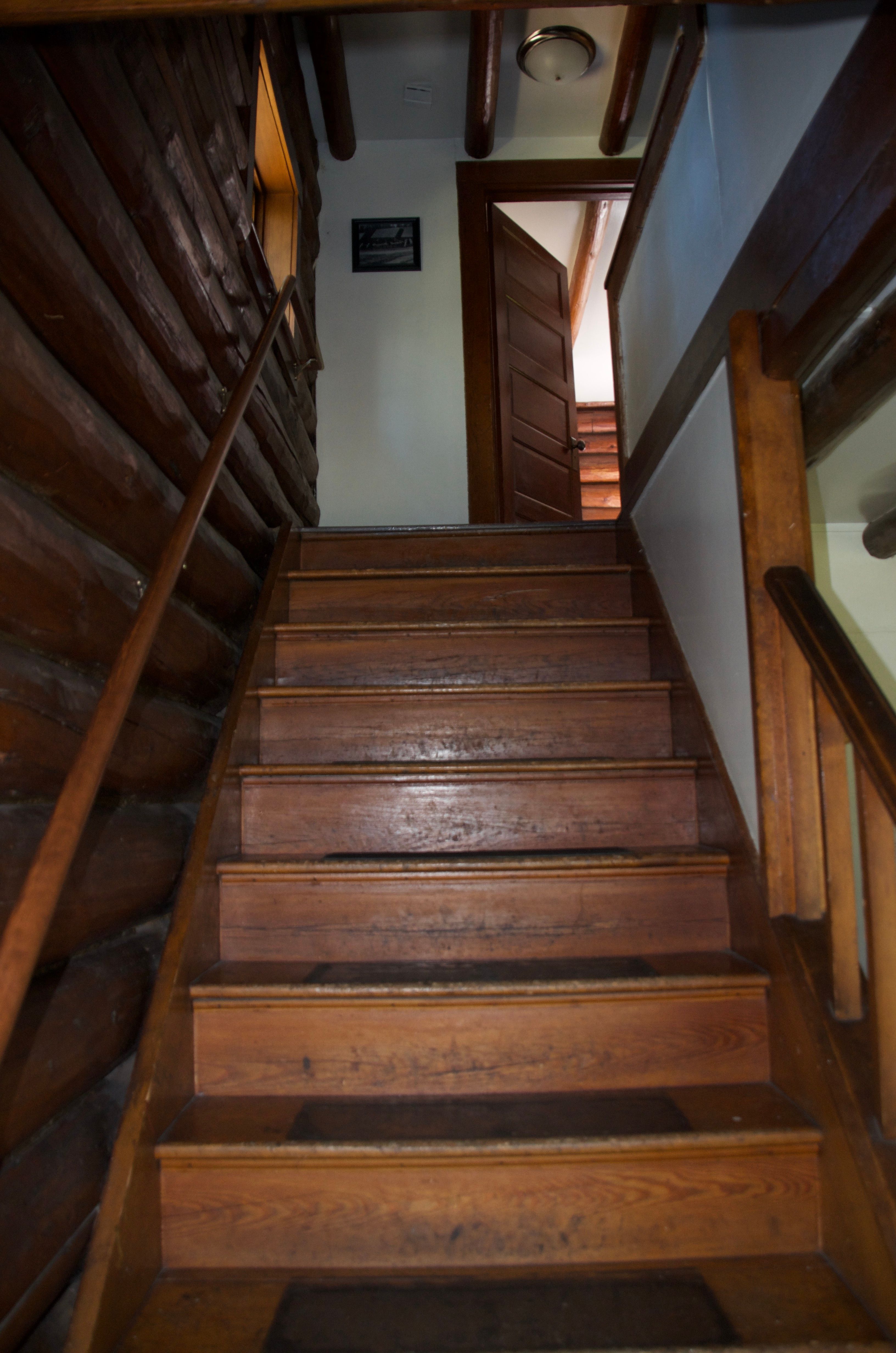 The steep original wooden staircase leading to the upper bedrooms at the Old Condon Ranger Station