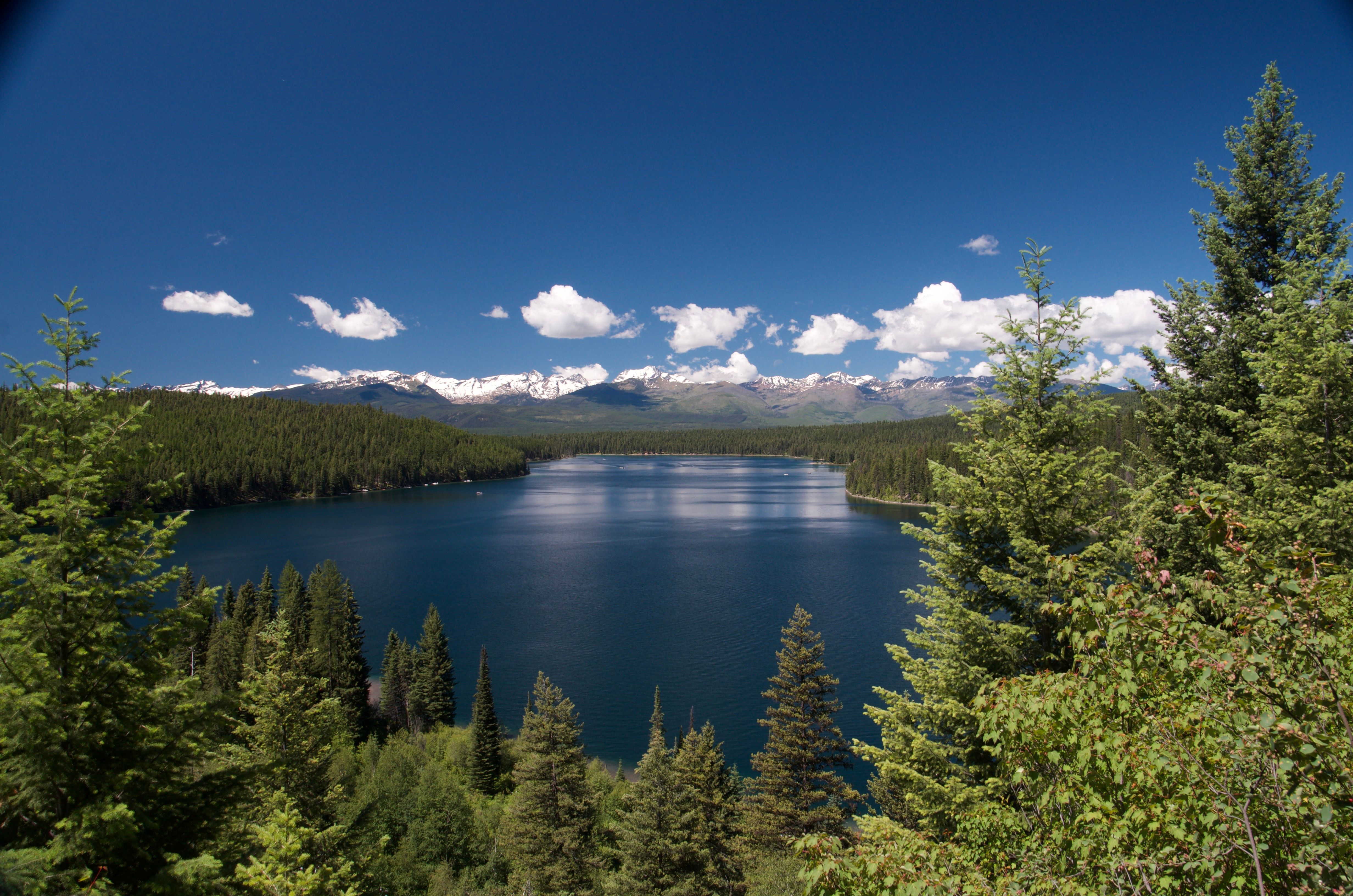 Wide view of Holland Lake and the Mission Mountains from an elevated point on the trail