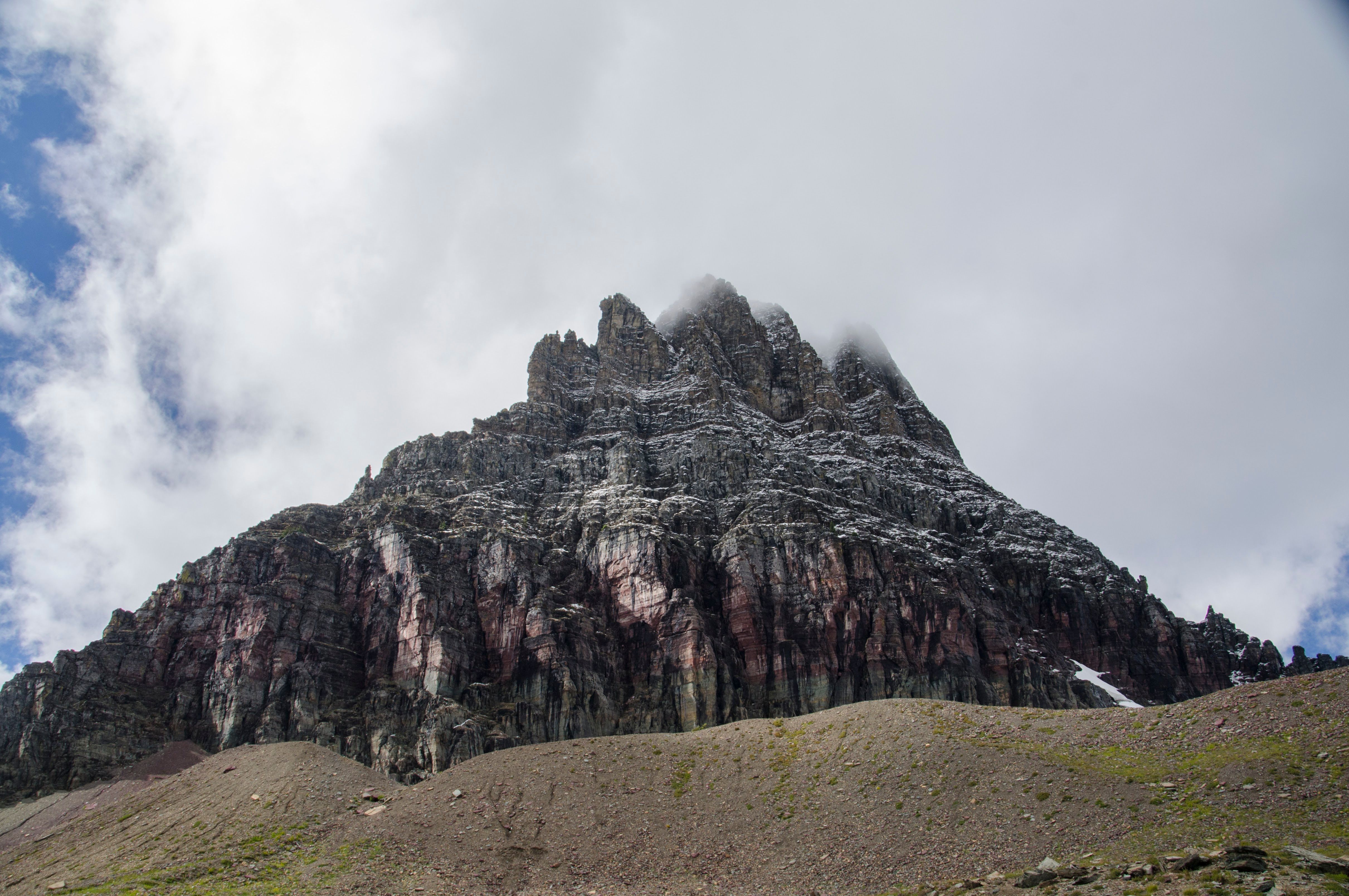 Dramatic close-up of Clements Mountain with clouds swirling around summit