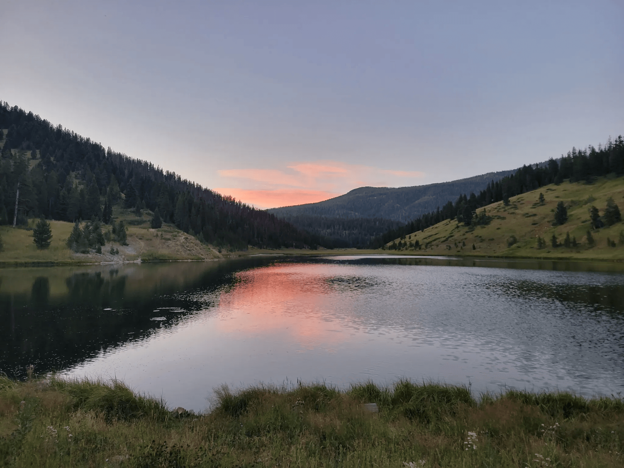 Mystic Lake at sunset with pink reflection on the water