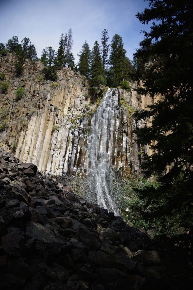Palisade Falls flowing in summer with columnar basalt cliffs