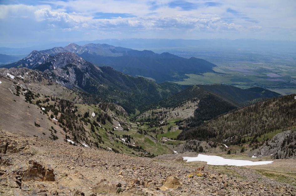 Sweeping summit view of Bridger Canyon valleys and distant mountain ranges