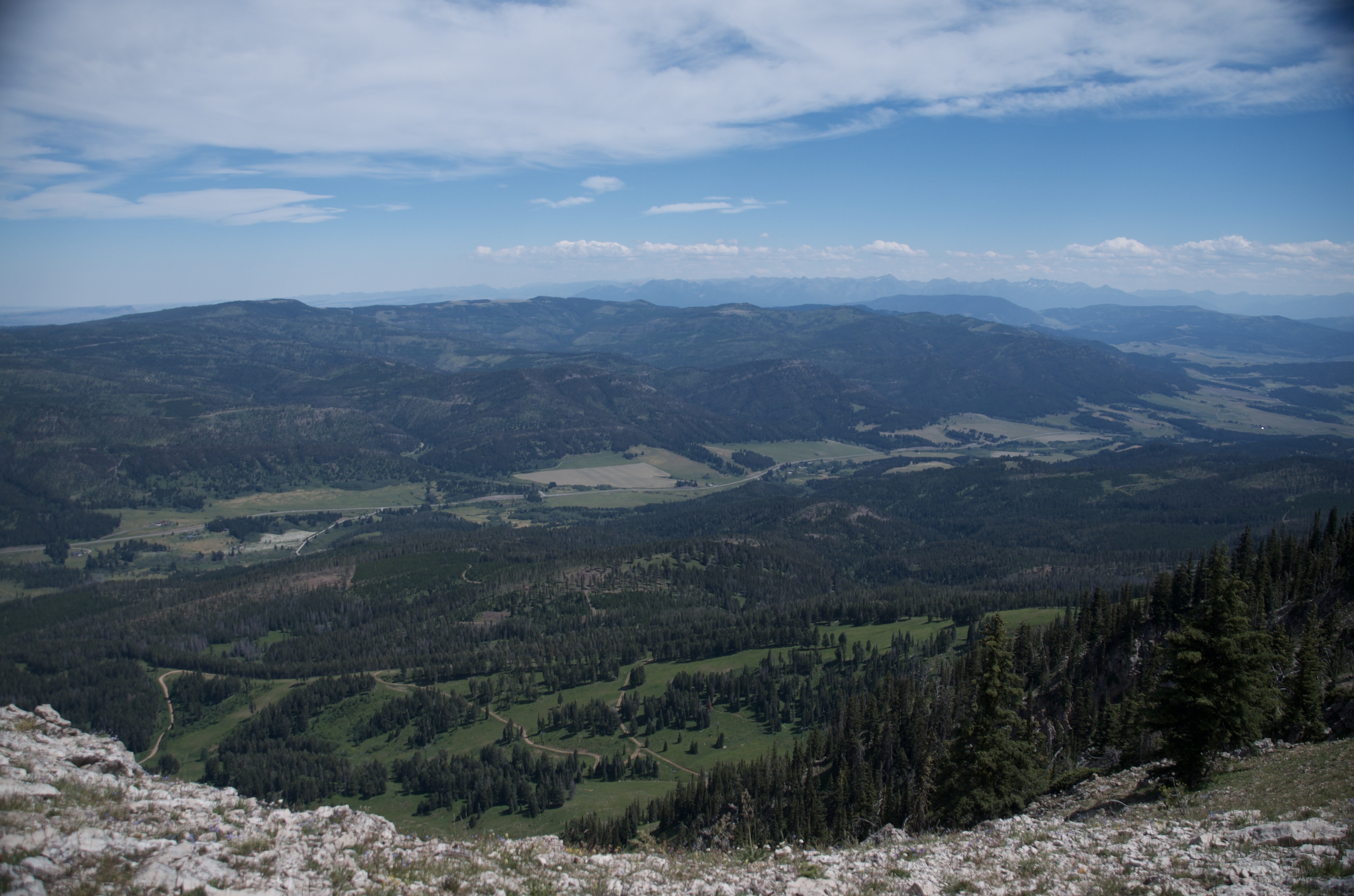 Sweeping east-facing view from the Bridger Ridge of ranches, forests, and rolling foothills stretching across the Gallatin Valley