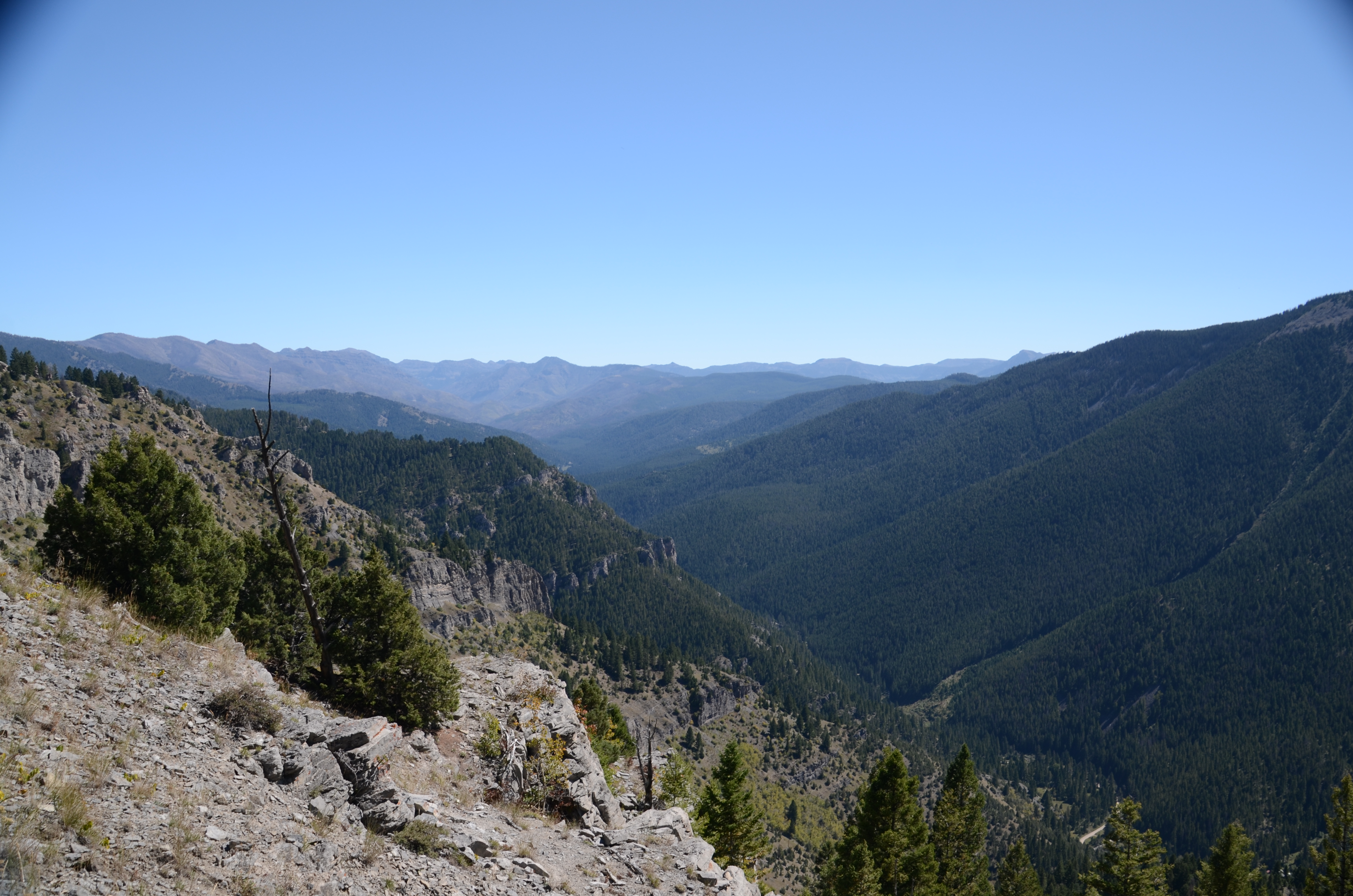 Loose rocky trail on the upper switchbacks of Storm Castle Peak with wide canyon views opening up