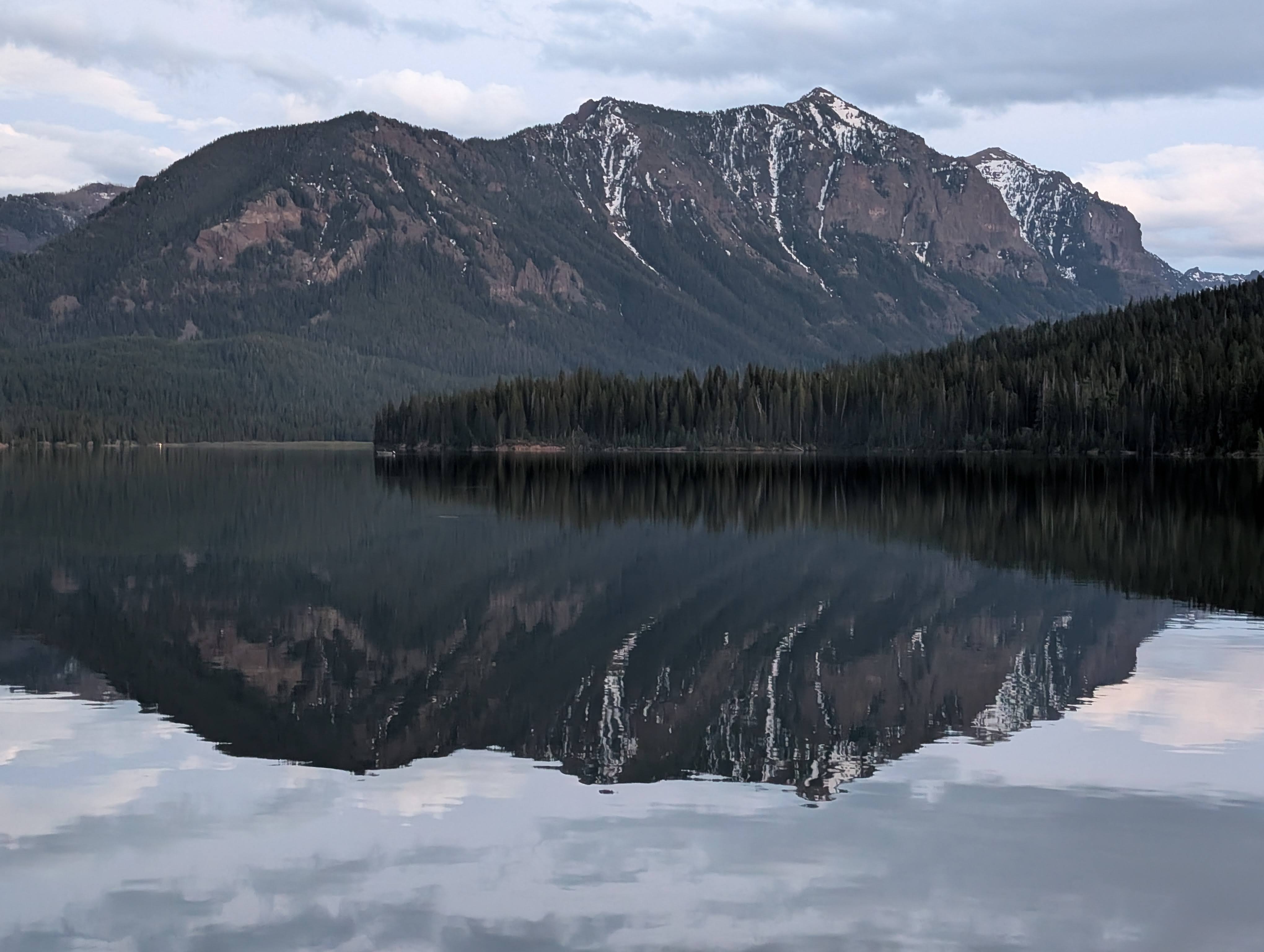Mountain reflection in the calm waters of Hyalite Reservoir